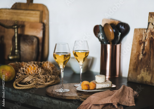 Two glasses of Trendy Orange or Amber wine and appetizers