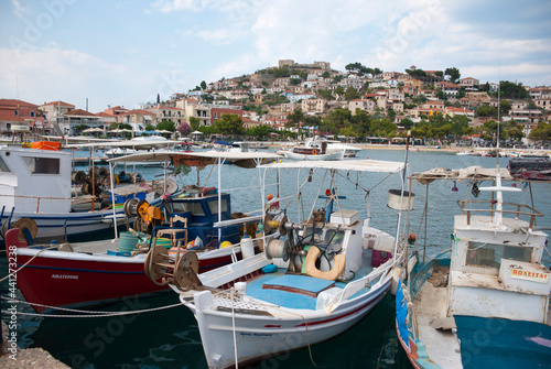 Astros Port, Peloponnese, Greece - June 24, 2021: Fishing boats at a picturesque fishing port.