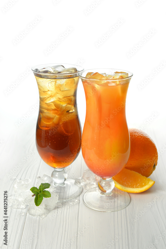 Two cocktails with decorations, fruits on white wood table texture. bar menu concept Two cocktails with decorations, fruits on white wood table texture. bar menu concept