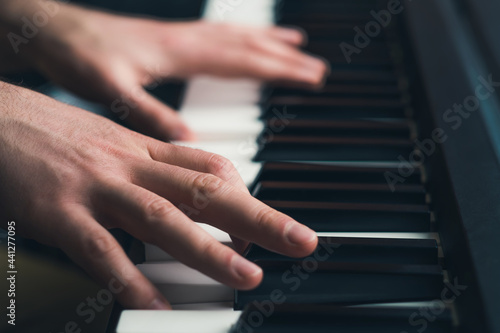 Man playing piano close up