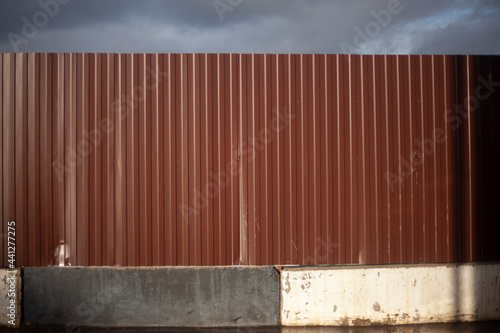 A metal fence. Brown fence.