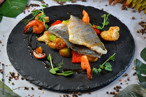 Fried dorado fish, with shrimps and vegetables - Image