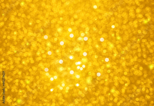 golden blurred bokeh abstract background with twinkle and sparkle texture.