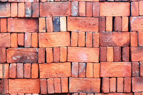 Closeup shot of a red brick wall during repairin photo