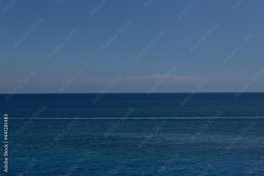 Blue color sea water summer panoramic view with sky 