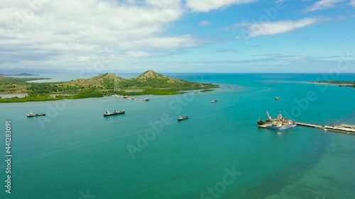 Top view of Sea port and harbor with cargo ships and tankers. Tapal Wharf, Bohol, Philippines. photo