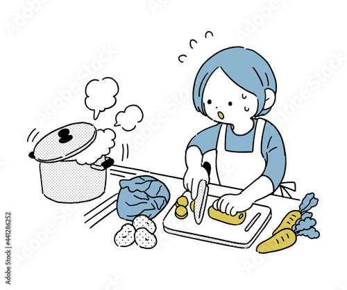 慌ただしく料理をする主婦　シンプル