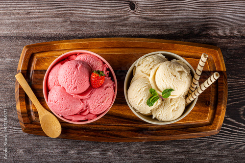 Bowls with strawberry and vanilla ice cream. photo