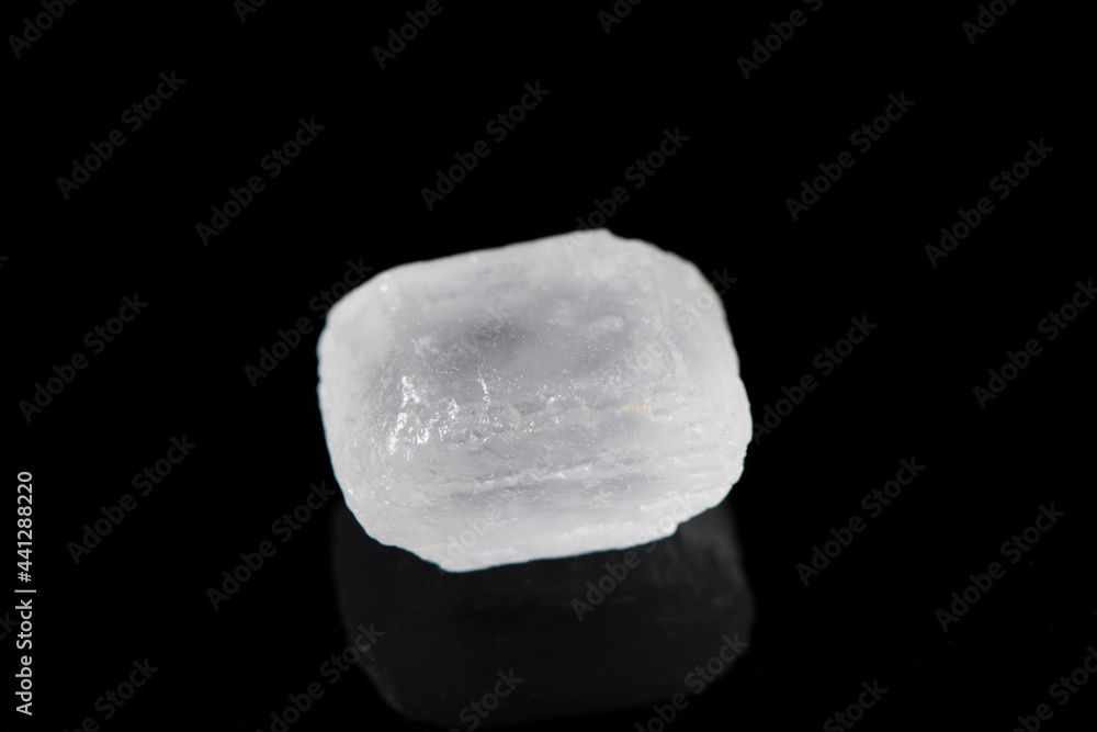 white rock candy sugar isolated on black background white rock candy sugar isolated on black background