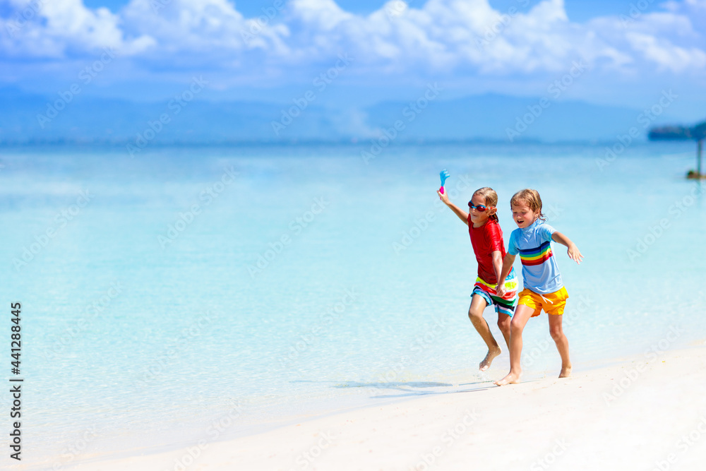 Kids playing on beach. Children play at sea. Kids playing on beach. Children play at sea.