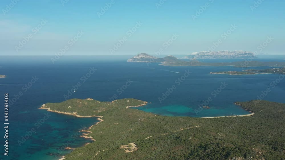 View from above, stunning aerial view of a green coastline with some beaches bathed by a turquoise sea. Liscia Ruja, Sardinia, Italy. View from above, stunning aerial view of a green coastline with some beaches bathed by a turquoise sea. Liscia Ruja, Sardinia, Italy.