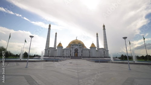 Beautiful Shot Of Fountains By Famous Mosque Against Cloudy Sky - Ashgabat, Turkmenistan photo
