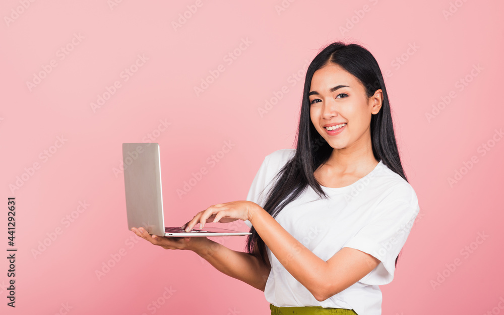 woman confident smiling holding using laptop computer and typing keyboard woman confident smiling holding using laptop computer and typing keyboard