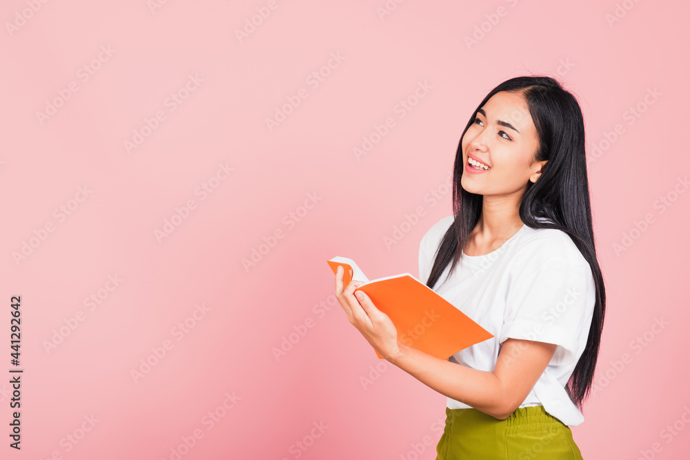 woman confident smiling standing holding orange book open woman confident smiling standing holding orange book open