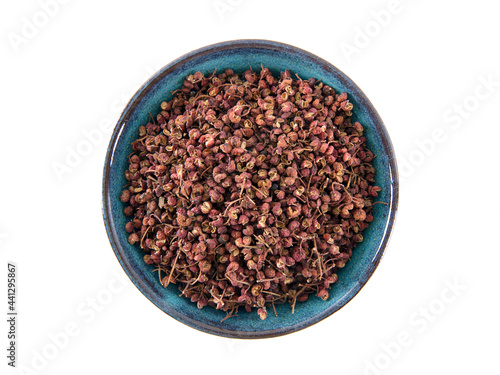 A bowl of dried peppercorns