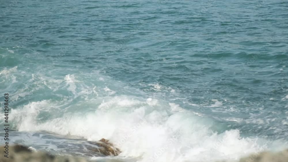 Choppy Sea Water. Small Waves. Surf. The Tide. Clean Water. Tourism. Distant Countries. Sea Foam. Rocky Shore. Natural Beauty. Power of Water. Energy. Meditation. Calmness. Wave Rolls over the Rocks Choppy Sea Water. Small Waves. Surf. The Tide. Clean Water. Tourism. Distant Countries. Sea Foam. Rocky Shore. Natural Beauty. Power of Water. Energy. Meditation. Calmness. Wave Rolls over the Rocks