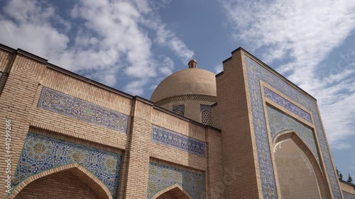 Panning Beautiful Shot Of Baha' Al-Din Naqshband On Sunny Day Against Cloudy Sky - Bukhara, Uzbekistan photo