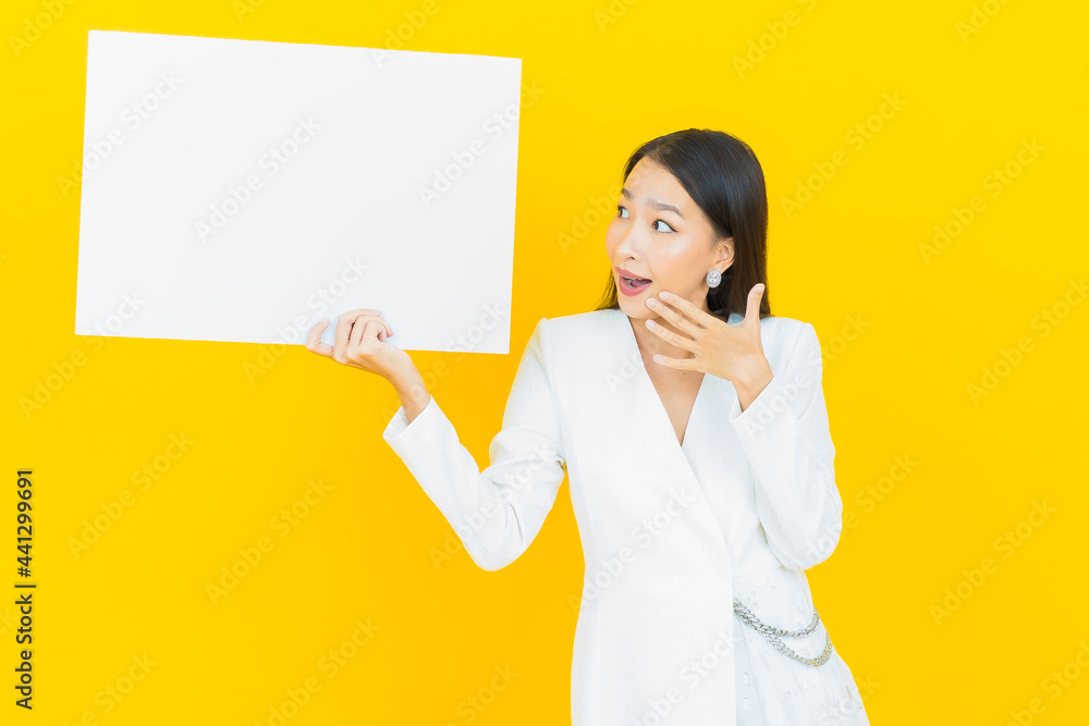 Portrait beautiful young asian woman with empty white billboard Portrait beautiful young asian woman with empty white billboard