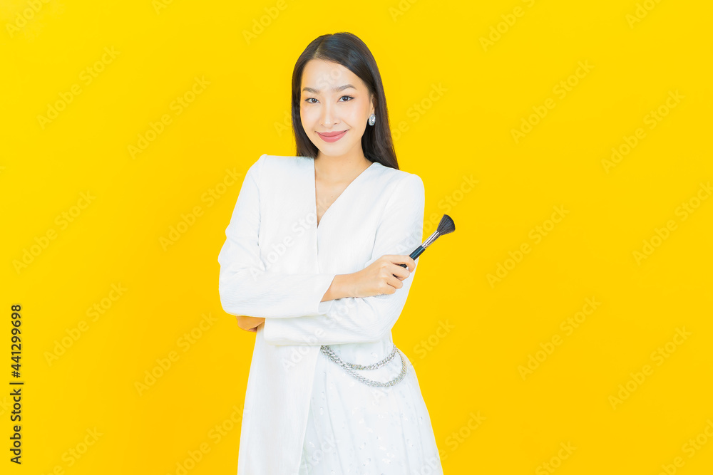 Portrait beautiful young asian woman with make up brush cosmetic Portrait beautiful young asian woman with make up brush cosmetic