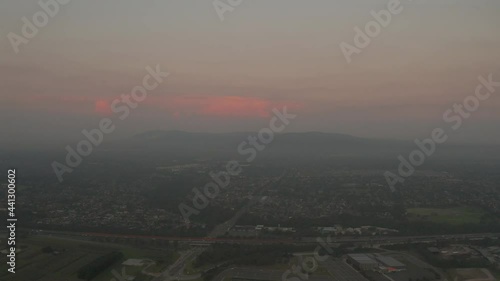 Aerial view of hazy suburban landscape with Eastlink highway below in Melbourne, Victoria, Australia. photo