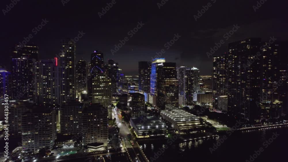 Aerial view of the Brickell Key Bridge and skyscrapers, night in Miami, Florida - reverse, drone shot Aerial view of the Brickell Key Bridge and skyscrapers, night in Miami, Florida - reverse, drone shot