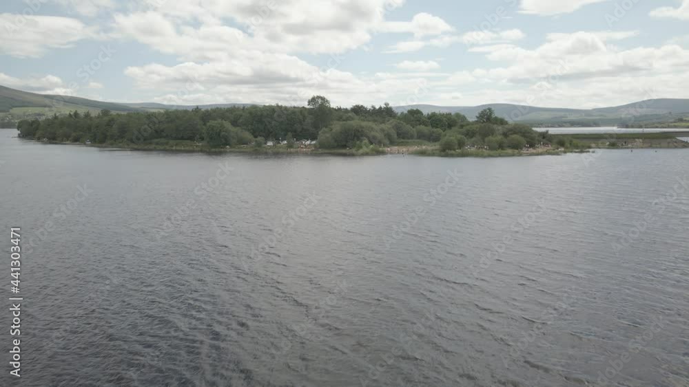 Top View Of Tourists Enjoying At The Lakeshore Of Blessington Lake In County Wicklow, Ireland. aerial Top View Of Tourists Enjoying At The Lakeshore Of Blessington Lake In County Wicklow, Ireland. aerial