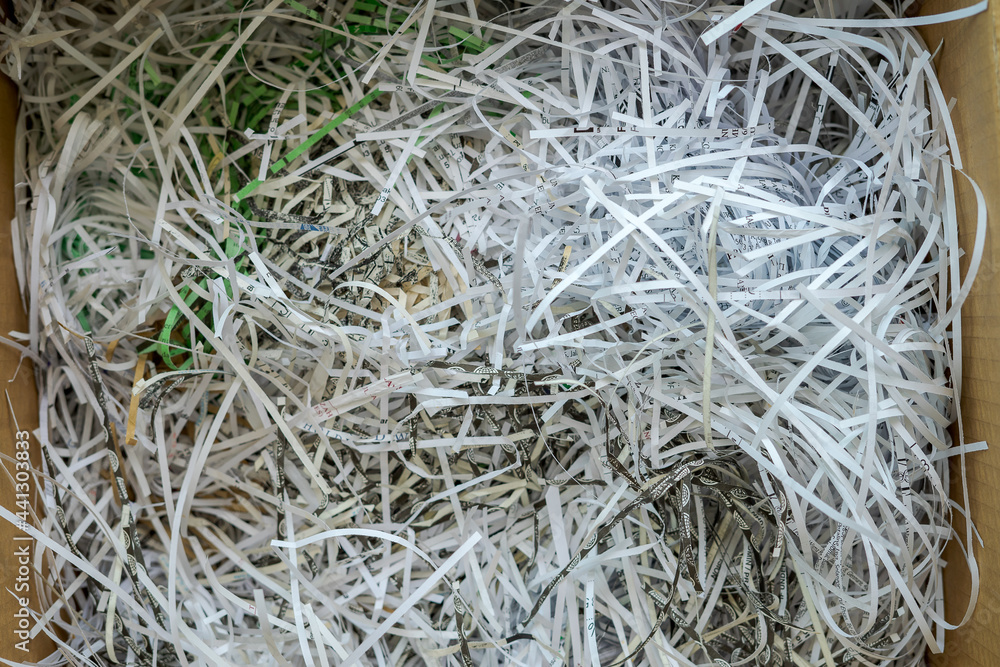 White shredded paper in a carboard box. White shredded paper in a carboard box.