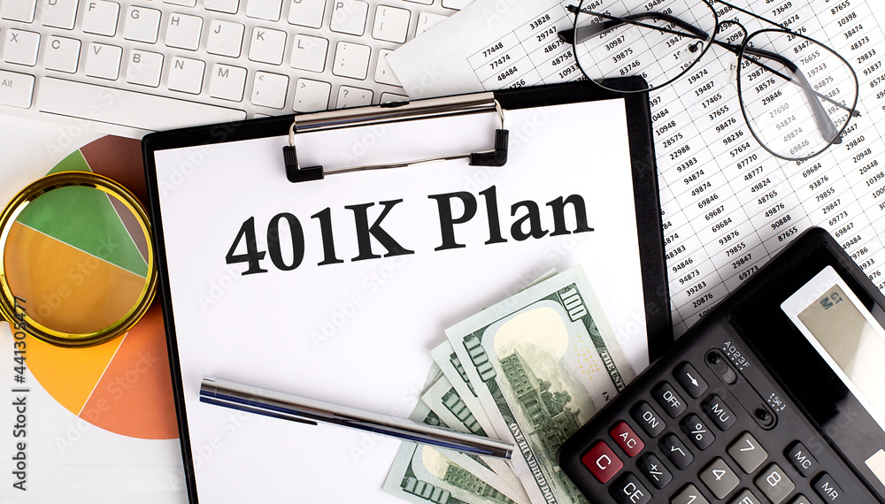 Text 401 K PLAN on Office desk table with keyboard,dollars,calculator ,supplies,analysis chart on white background.