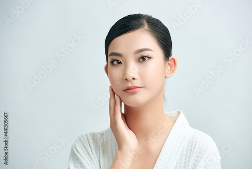 Beautiful Asian young woman touching soft cheek smile with clean fresh skin Happiness and cheerful with positive emotiona