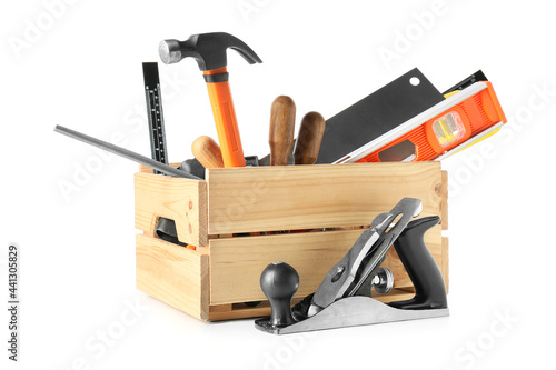Box with different carpenter's tools on white background