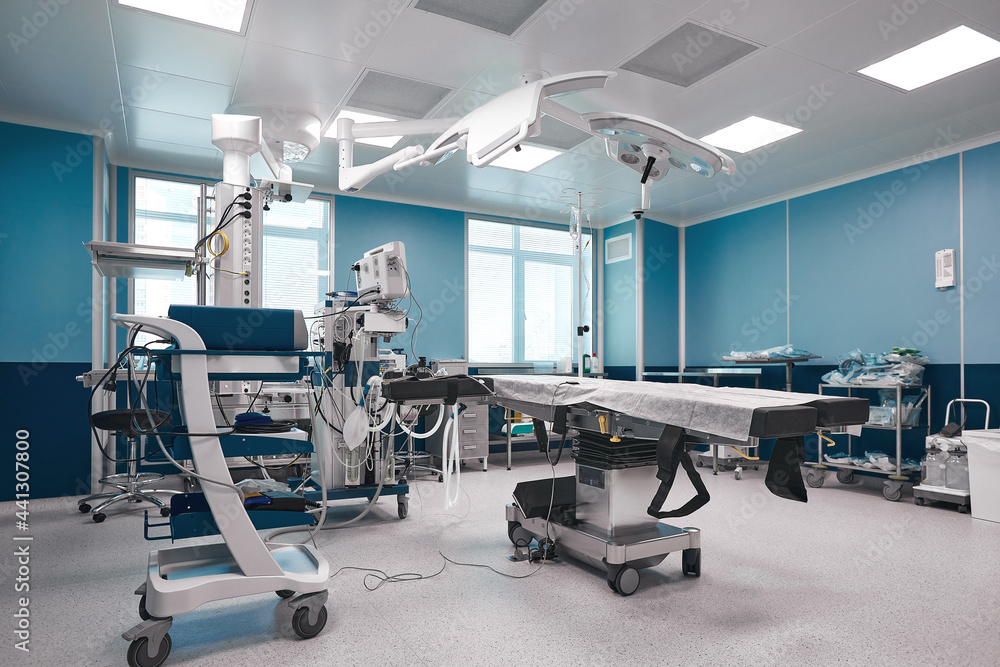Fototapeta premium Operating board with a large amount of light, with modern equipment for various complex operations, operating table, lamps, ventilator.