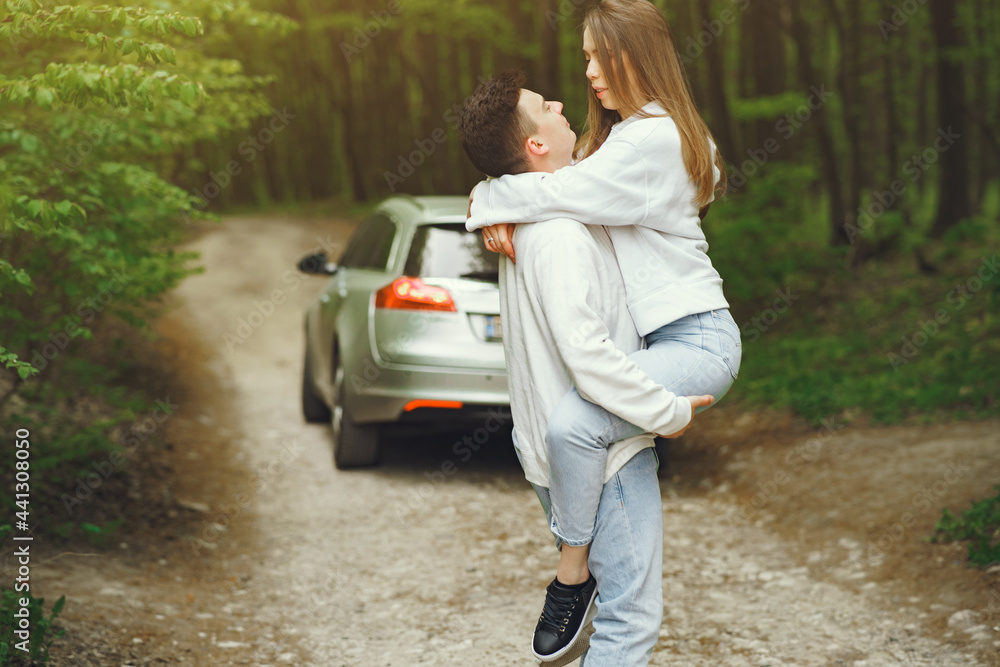 Fototapeta premium Beautiful couple spend time in a spring forest