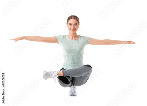 Fotografia Sporty young woman doing yoga on white background