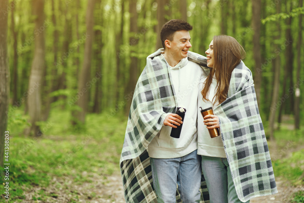 Fototapeta premium Beautiful couple spend time in a spring forest