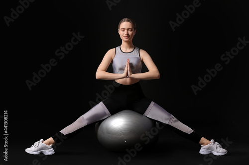 Sporty young woman with fit...
