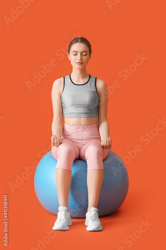 Sporty young woman with fit...