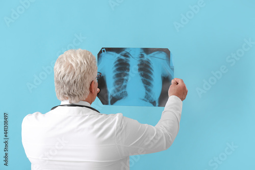 Medical doctor examining ch...