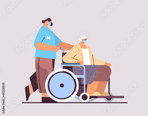 helper taking care of senior disabled patient nurse pushing wheelchair care service concept