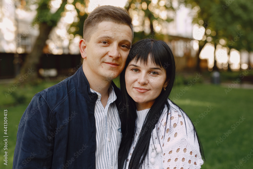 Beautiful couple spend time on a summer park Beautiful couple spend time on a summer park
