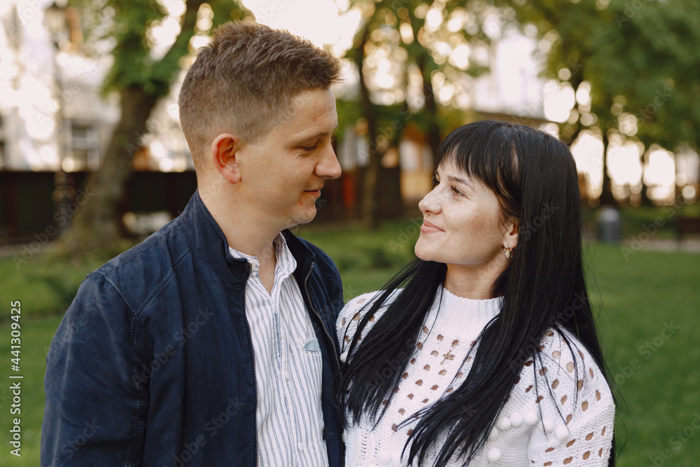 Beautiful couple spend time on a summer park Beautiful couple spend time on a summer park