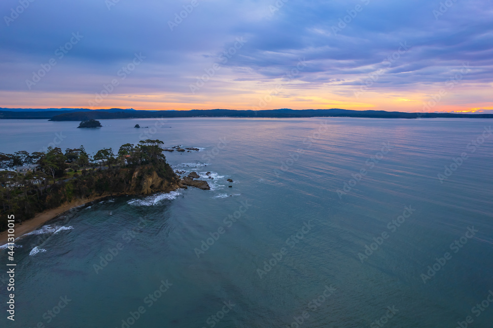 Cloud covered aerial sunrise seascape over the cove Cloud covered aerial sunrise seascape over the cove