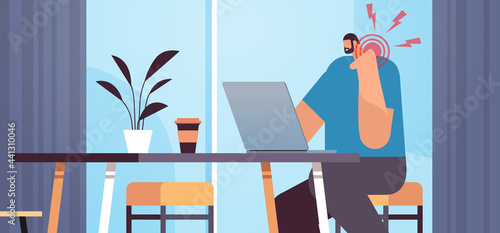 businessman at workplace suffering from neck pain inflammation of muscles concept