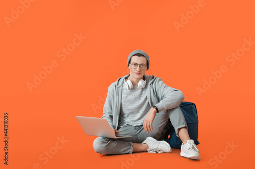 Male student with laptop on...