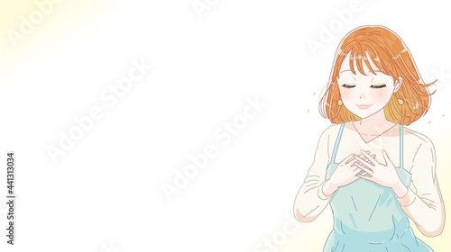 胸に手を当てる女性