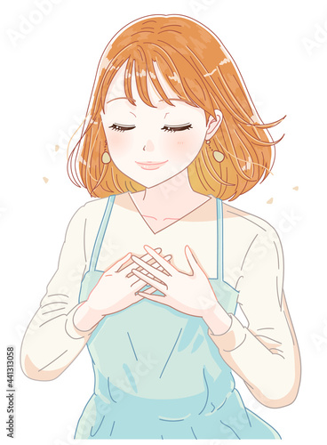 胸に手を当てる女性