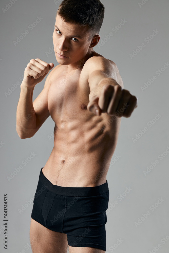 boxer on a gray background naked torso cubes on the stomach fitness boxer on a gray background naked torso cubes on the stomach fitness
