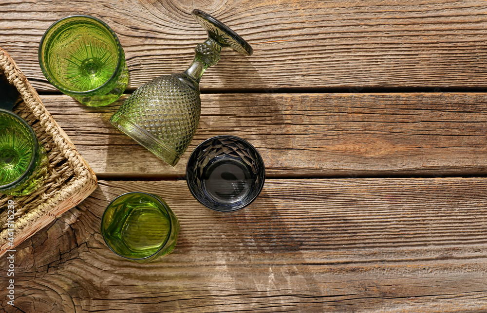 Beautiful empty glasses on wooden background Beautiful empty glasses on wooden background
