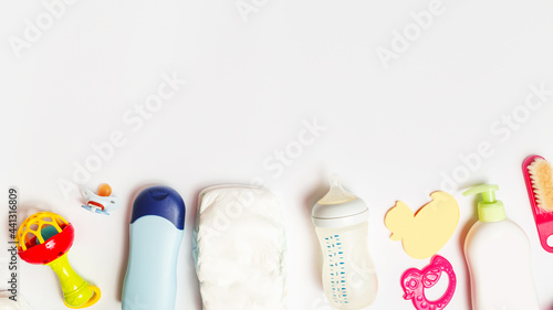 Baby cosmetic products, accessories, toy and isolated on white. Motherhood concept