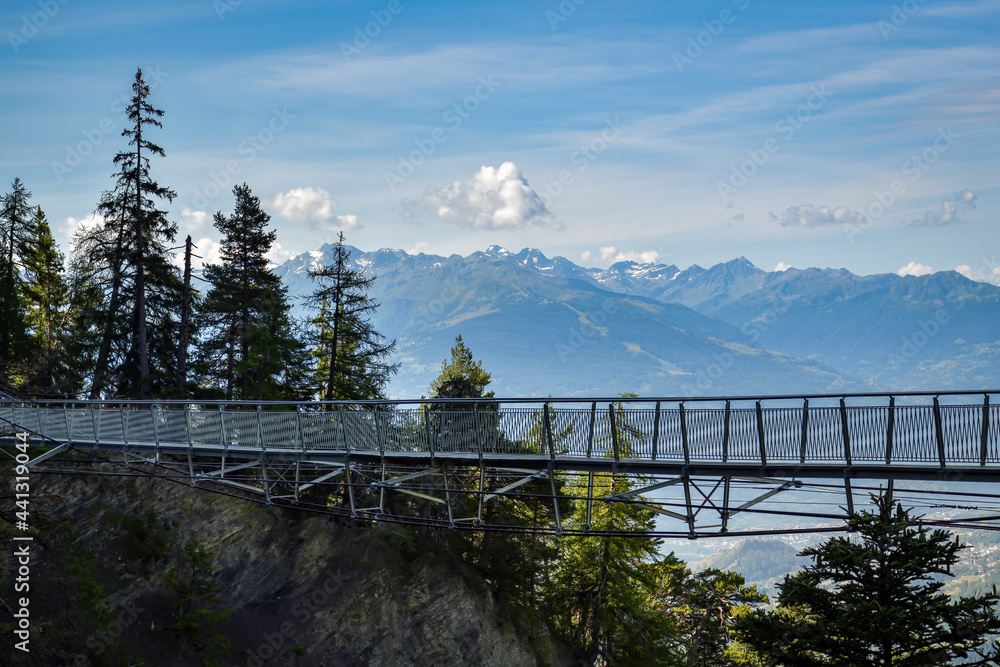 Suspension bridge on walking trail near Crans Montana in canton of Valais - obrazy, fototapety, plakaty 