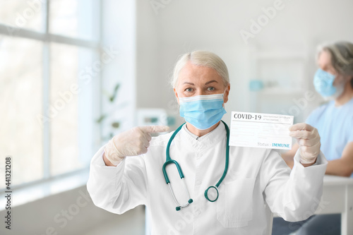 Senior female doctor in med...